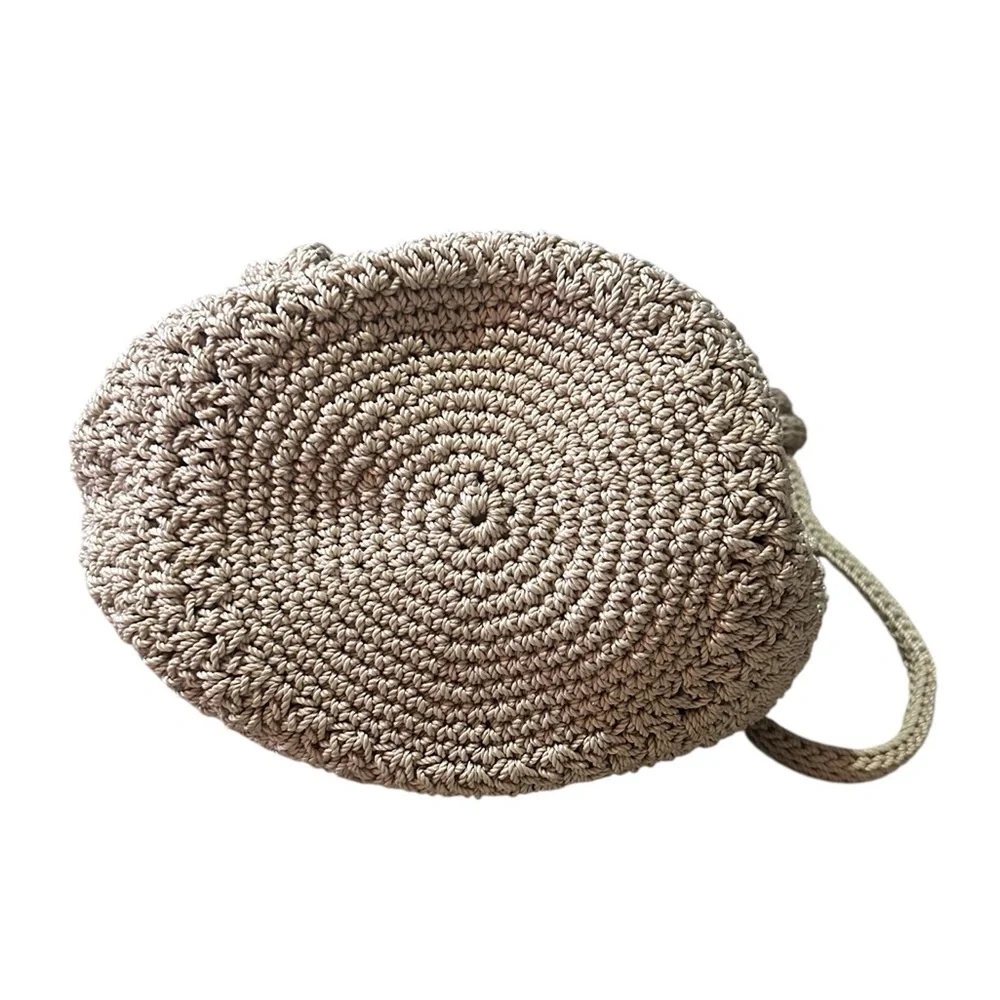 The Sak Crochet Crossbody Bucket Bag Floral Lining Draw Pull Closure Beige